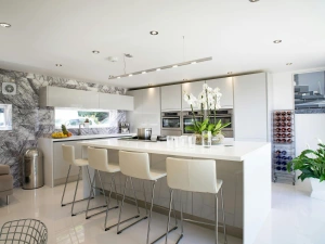 Oven, combination microwave, counter seating for 4, 3-seater sofa and wine rack