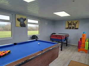 Games room with table football, pool table and Connect 4