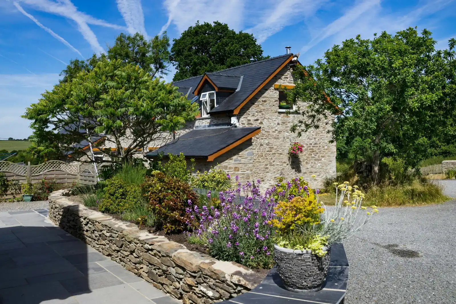 Towy Cottage with parking at the side and flower beds