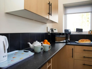 Kitchen with kettle and microwave