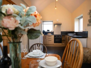 Dining area with table laid for dinner