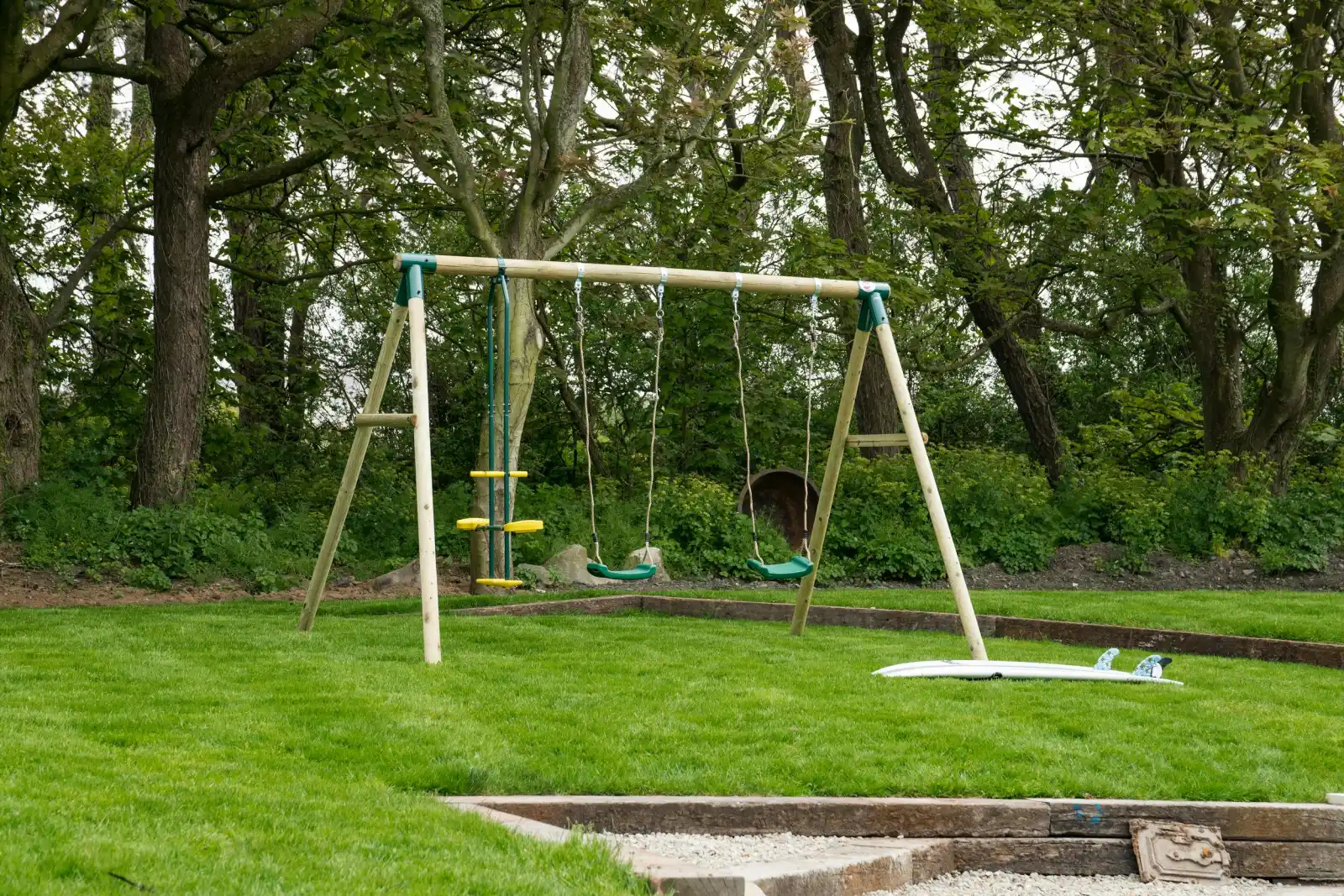 Garden with swings at Towyn Farmhouse