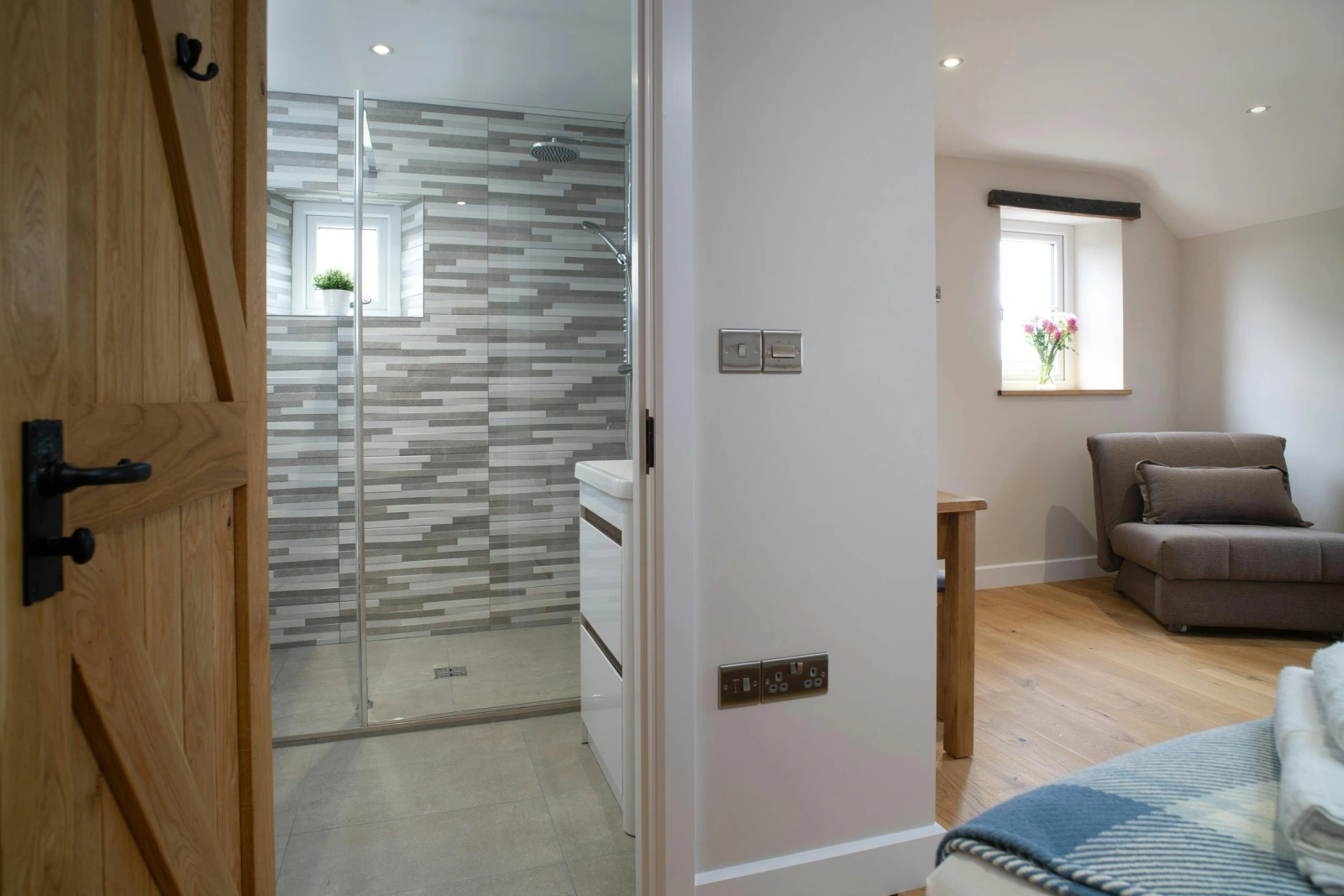 Shower room and bedroom at Towyn Farmhouse