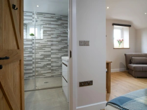 Shower room and bedroom at Towyn Farmhouse
