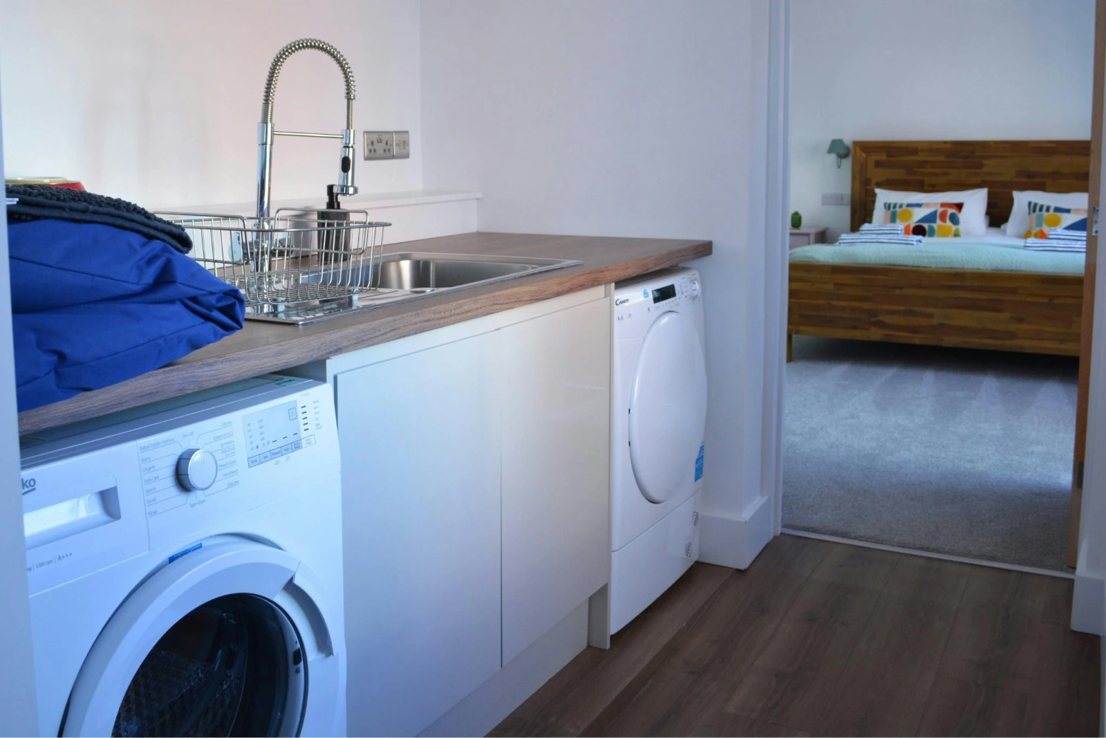 Utility room, washing machine, tumble dryer and sink