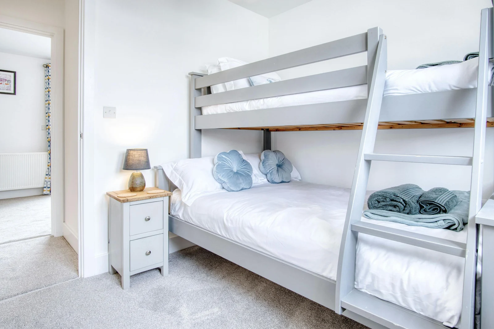 Bunk beds, bedside cupboard and lamp