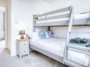 Bunk beds, bedside cupboard and lamp