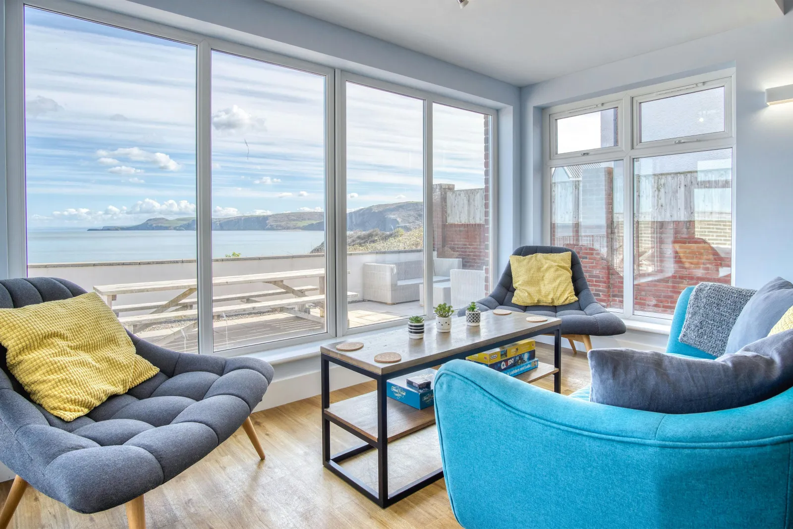 Armchair, 2 chairs and coffee table by the patio doors in the dining area