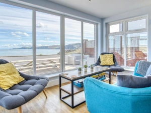 Armchair, 2 chairs and coffee table by the patio doors in the dining area