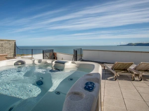 Hot tub on the patio, 2 steamer seats and sea views