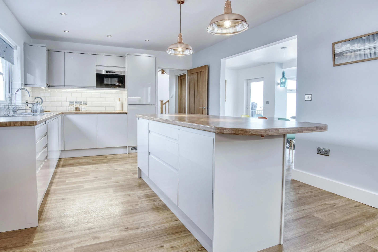 Kitchen showing central island and fitted units