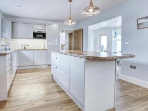 Kitchen showing central island and fitted units