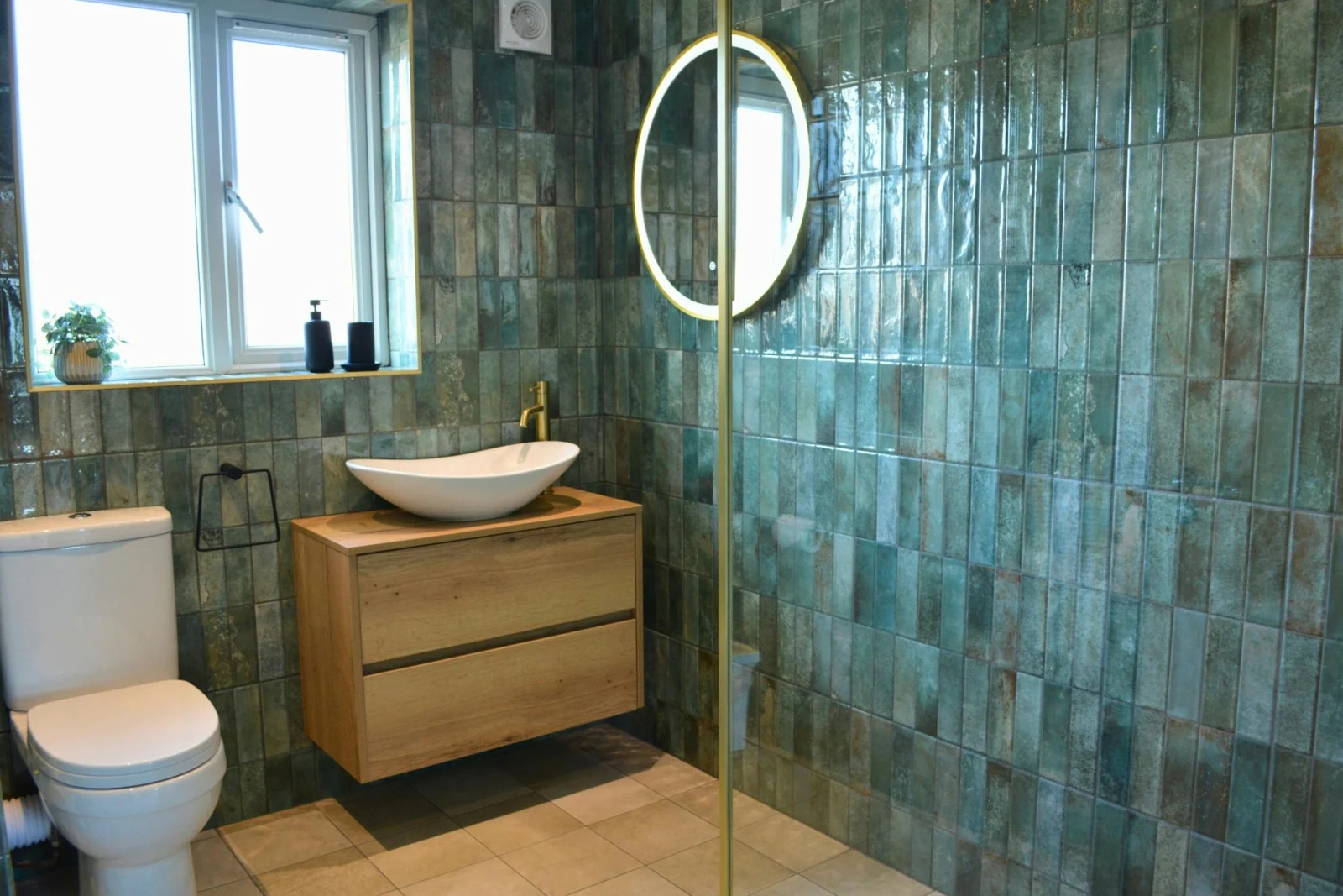 Bathroom with shower, wash basin, mirror and window