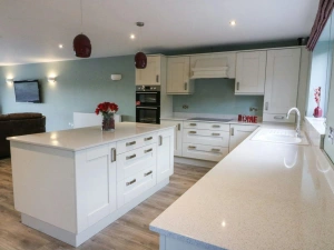 Fitted kitchen with built-in oven and hob