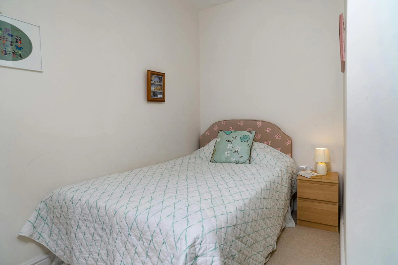 Single bed, bedside cabinet and lamp