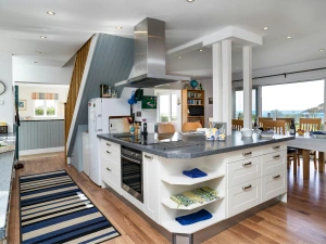 Living area, kitchen and dining table