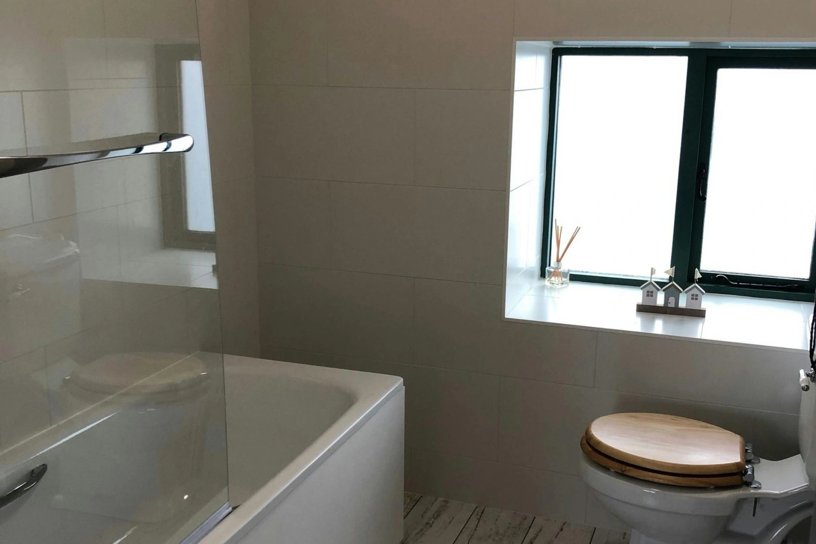 Bathroom with shower over and WC