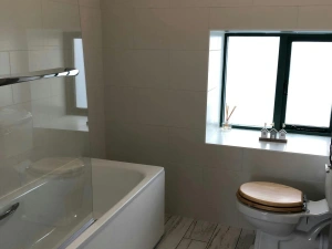 Bathroom with shower over and WC