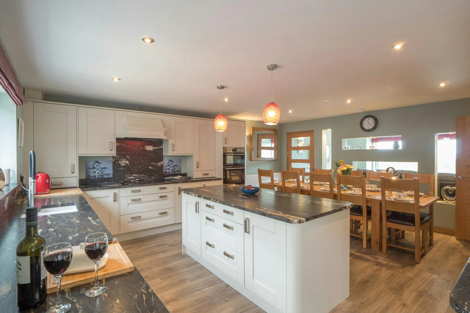 Island in the kitchen with dining table in the background