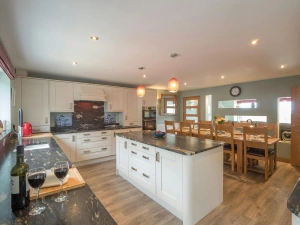 Island in the kitchen with dining table in the background