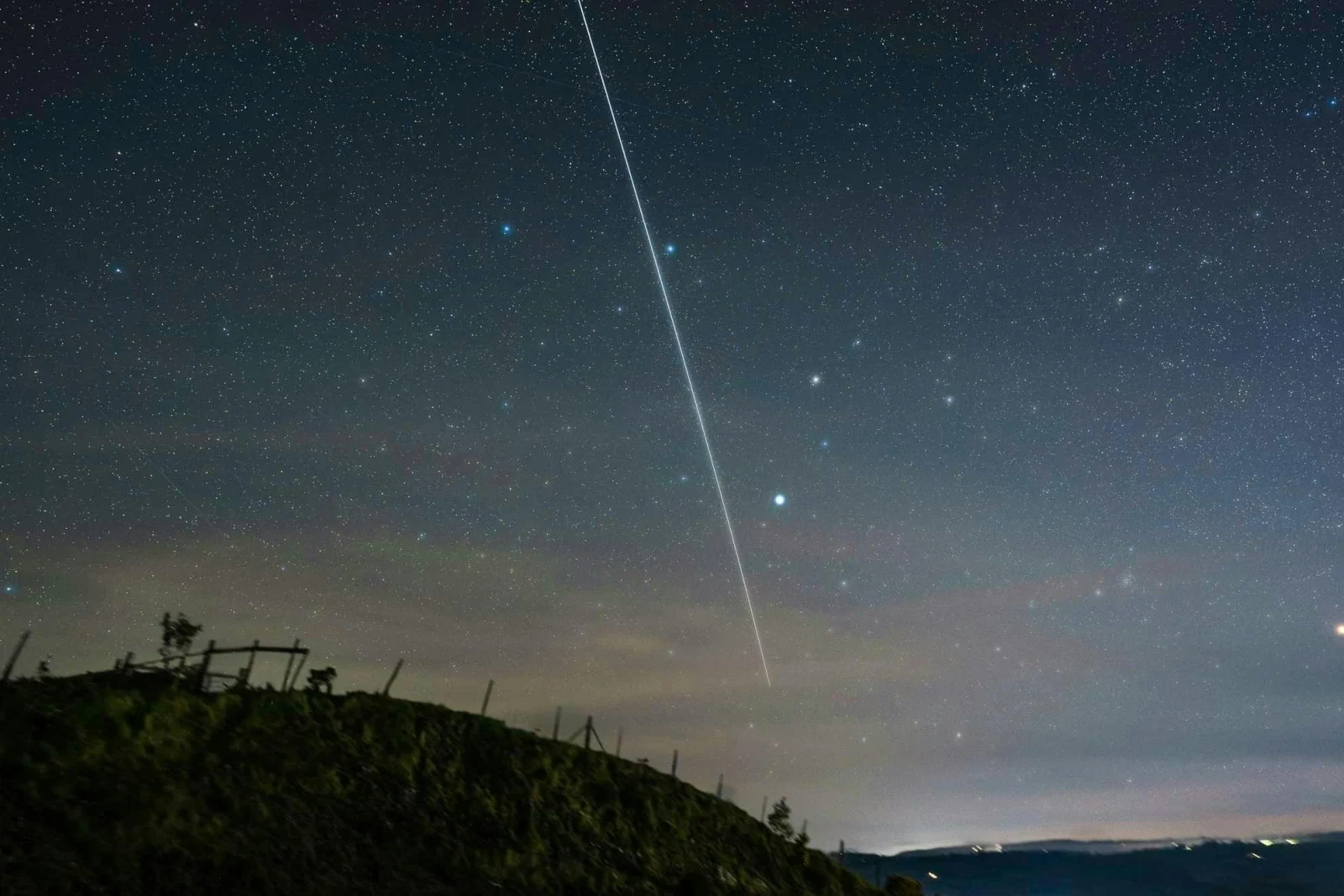 Night sky with shooting star
