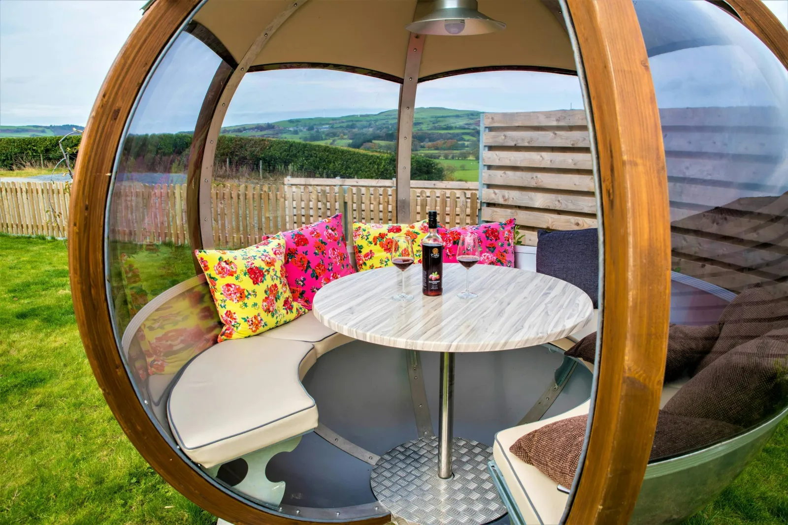 Rotating sphere with table and chairs in the garden