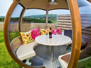 Rotating sphere with table and chairs in the garden