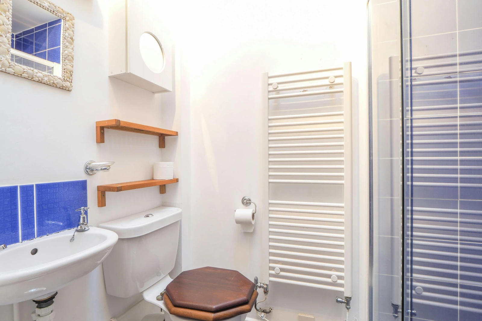 Toilet, shower enclosure, hand basin