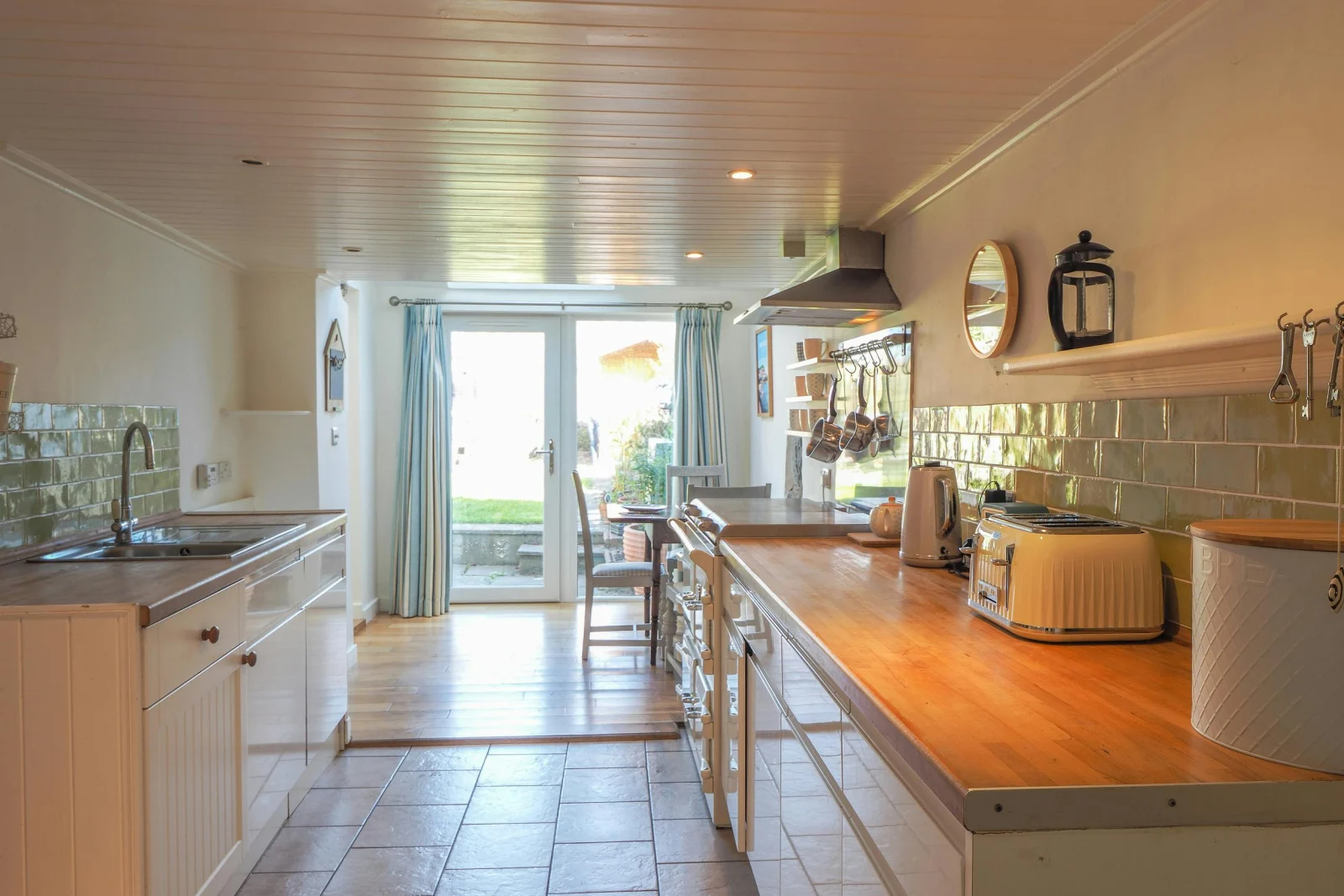 Kitchen floor cabinets, toaster, kettle, sink