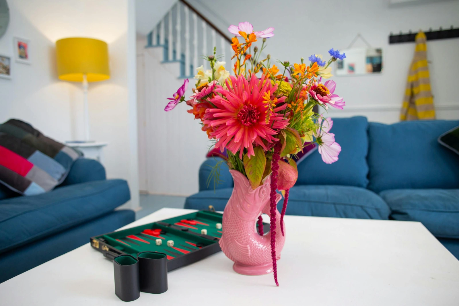 Sitting room with coffee table with a vase of flowers