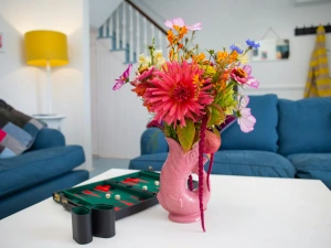 Sitting room with coffee table with a vase of flowers