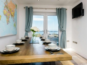 Map of the world on the wall, table and benches laid for lunch