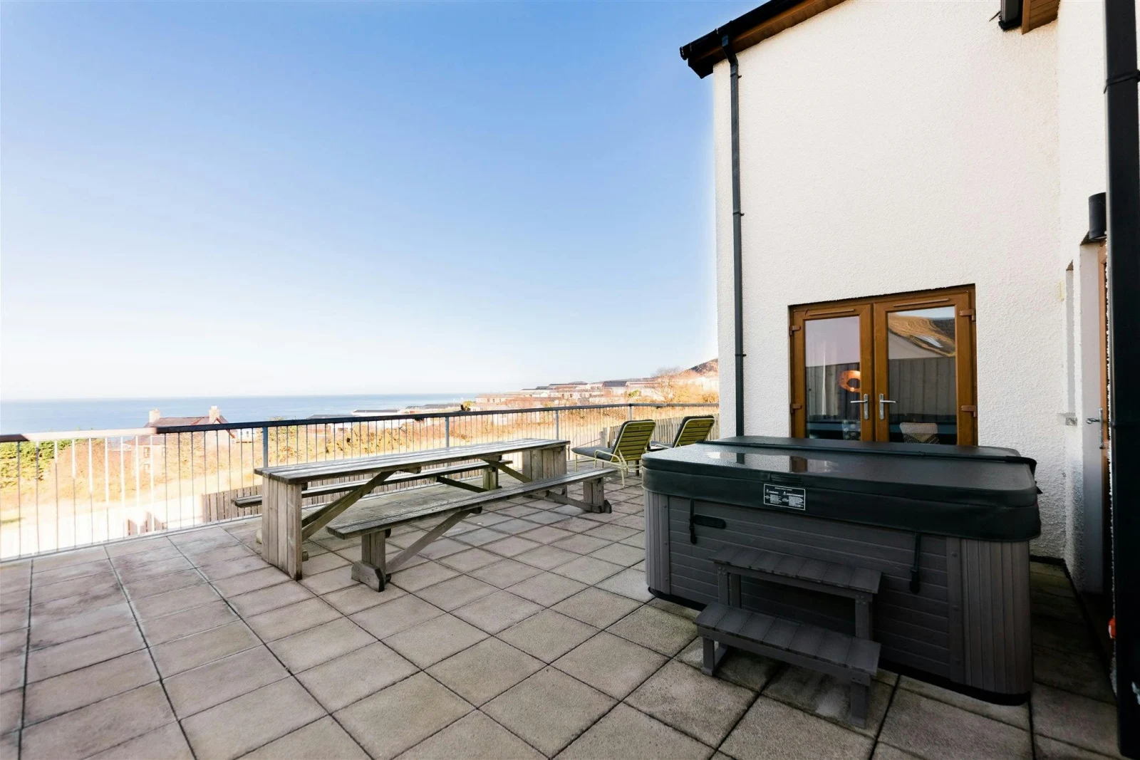 Hot tub, benches on the patio