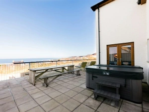 Hot tub, benches on the patio