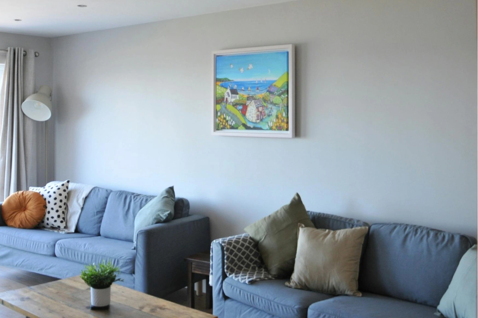 Two large sofas, coffee table and floor lamp