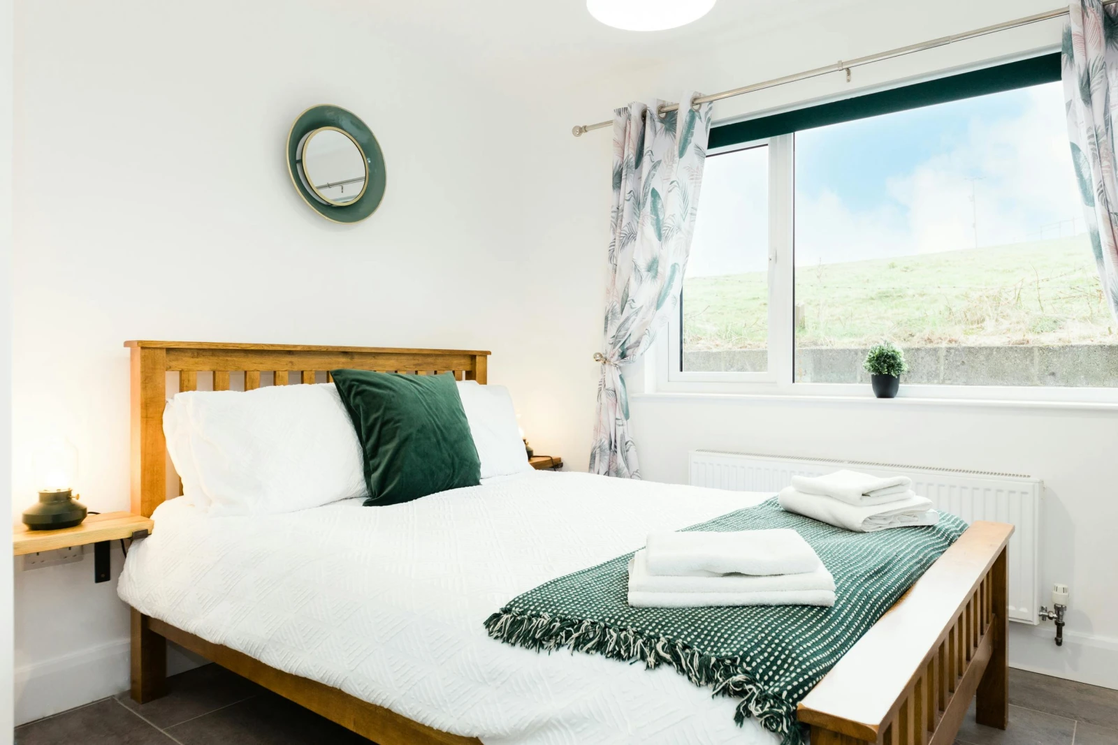 Double bedroom with bedside shelves and lamps