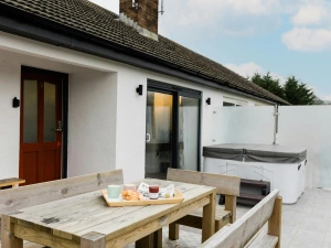 Outside hot tub and picnic bench.