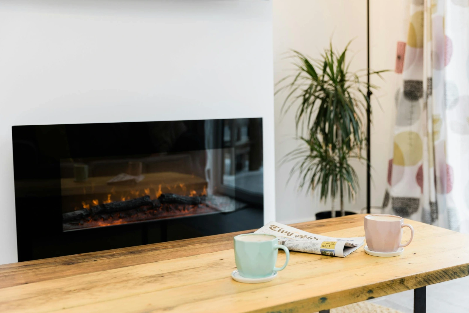 wooden coffee table with a wall mounted heater