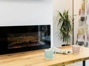 wooden coffee table with a wall mounted heater