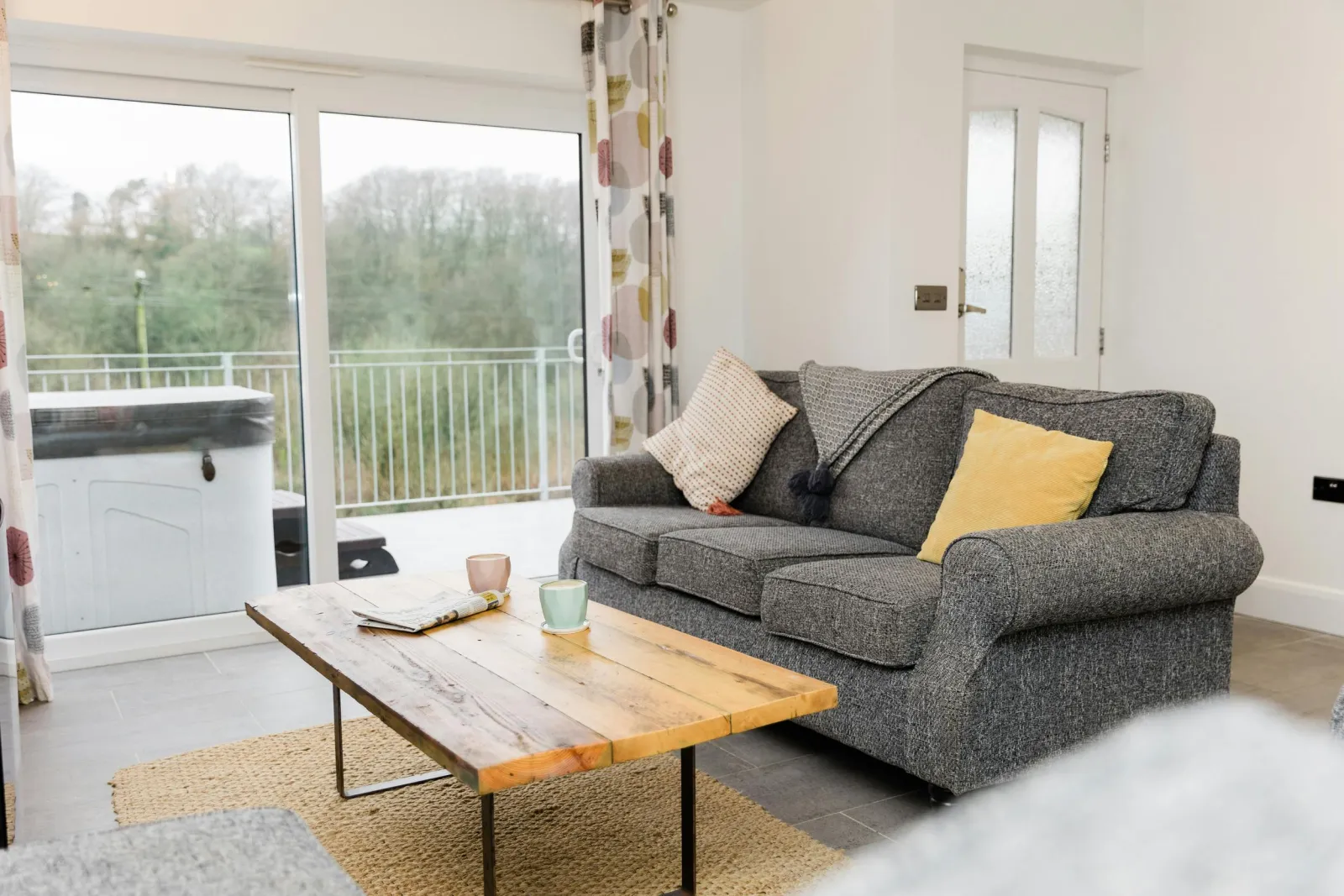 Living room with sofa set ,floor rug and wooden coffee table
