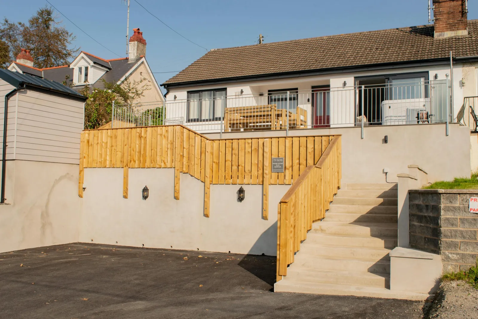Front of the house with steps leading up to the property.