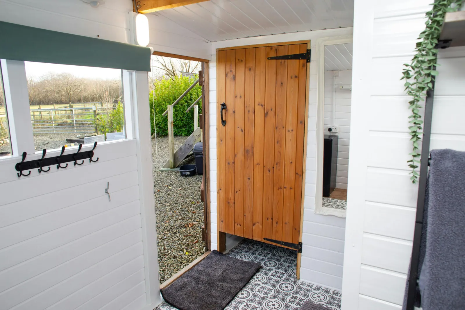 Shower room with tiled floor and views