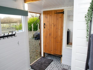Shower room with tiled floor and views