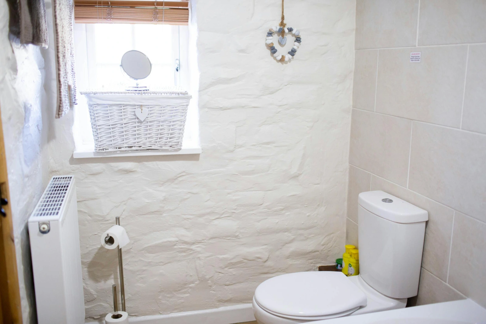 WC. Radiator. Window with blinds