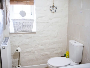 WC. Radiator. Window with blinds