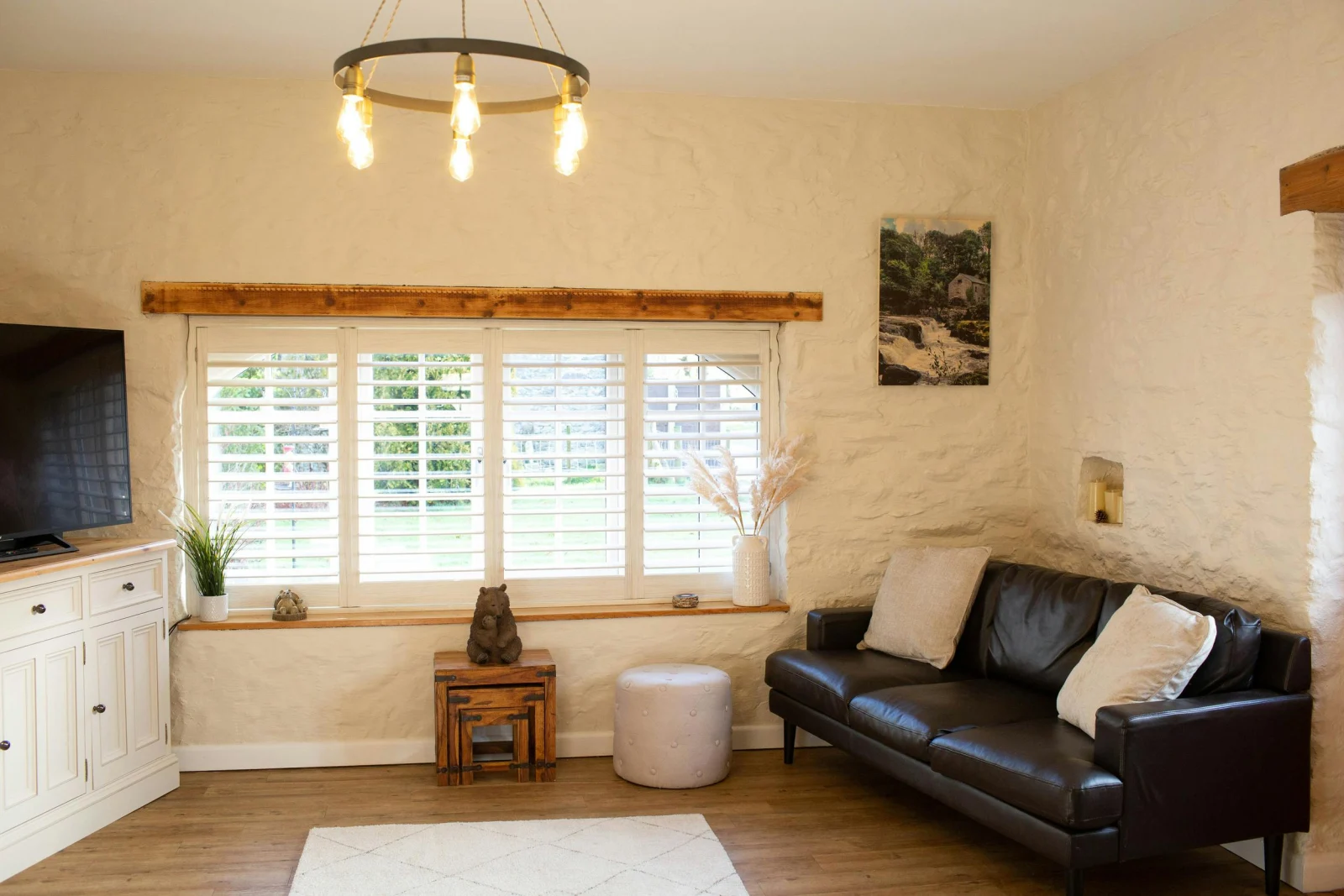 Sitting room with large window with blinds
