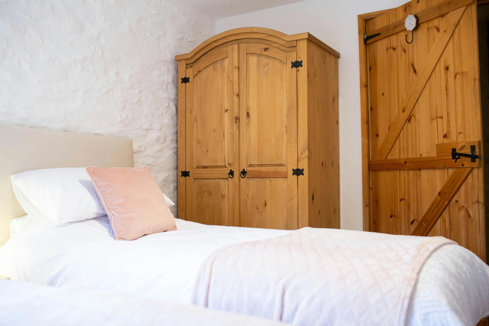 Double wardrobe. Twin beds with white bed linen