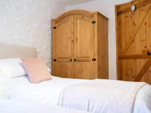 Double wardrobe. Twin beds with white bed linen