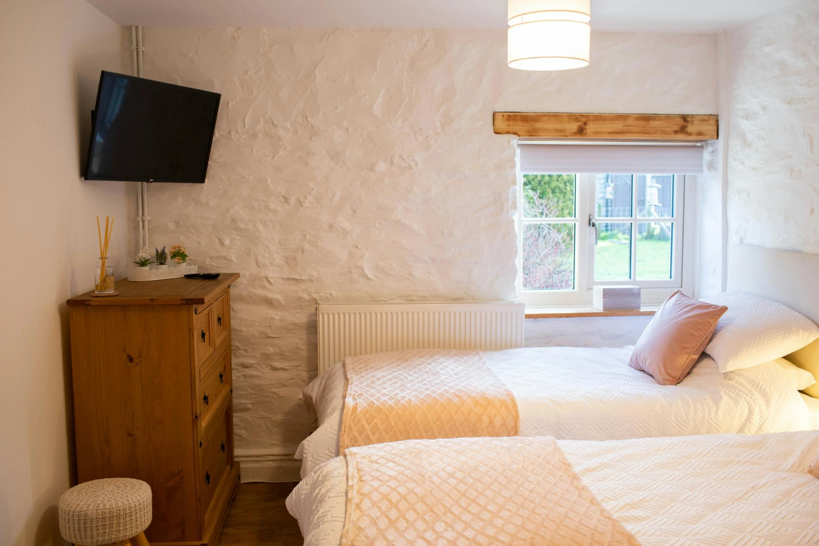 Wall mounted TV. Chest of drawers