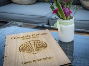 Glendale Cottage guest book on the coffee table in the sitting room